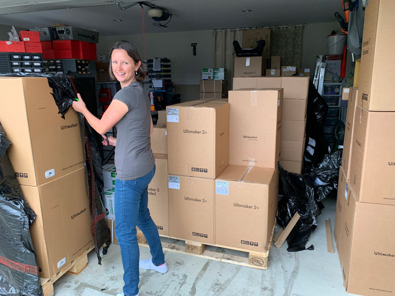 Fay surrounded by Ultimaker boxes